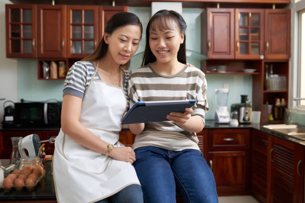 Mother and daughter reading recip