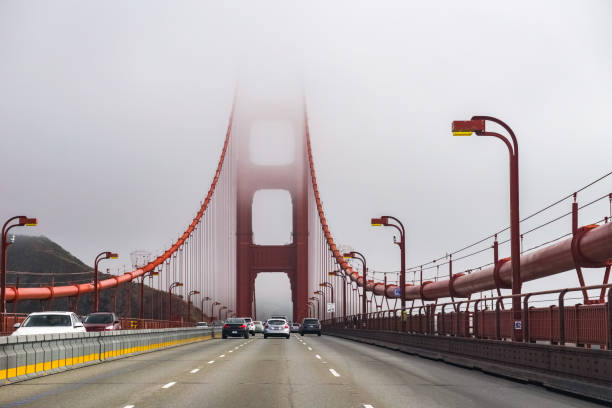 Golden Gate Bridge engulfed by fog and clouds, San Francisco