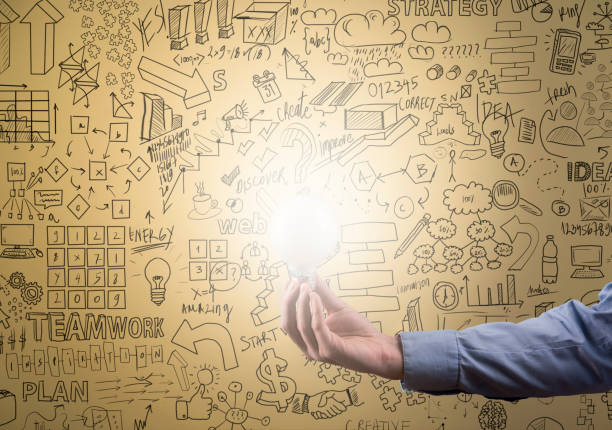 istock Female holding bulb with charts on yellow background (Click for more) 1134148855