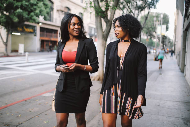 istock Two young female friends walking in downtown LA 1134149741