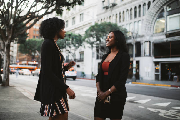 istock Two young female friends talking in downtown LA 1134149780