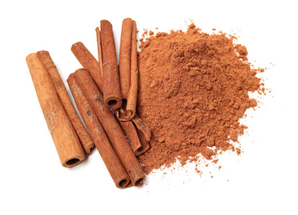 istock Cinnamon Sticks and Ground Cinnamon on a white background 1134150275