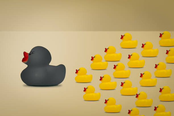 istock Rubber ducks in  leadership concept on a yellow background. 1134151919