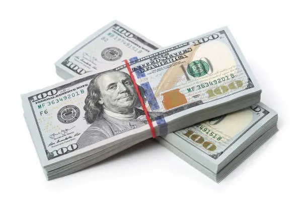 Many bundle of US 100 dollars bank notes isolated on white background