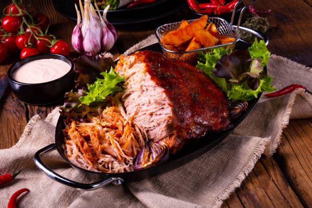 istock delicious pulled pork with baked potato quarters 1134156997