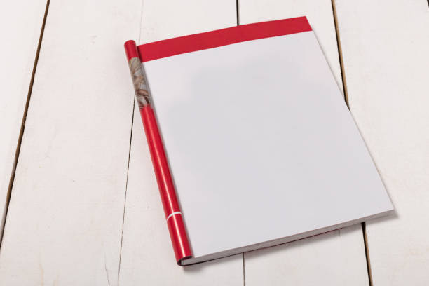 istock Mock-up magazine or catalog on wooden table. Blank page or notepad on wood background. Blank page or notepad for mockups or simulations 1134159042