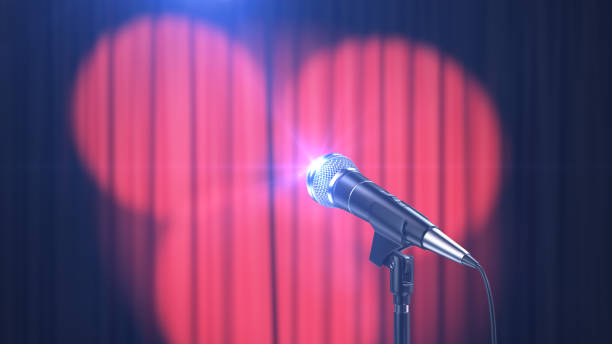 istock Concert Background, Microphone and Curtains with Spotlights 1134159191