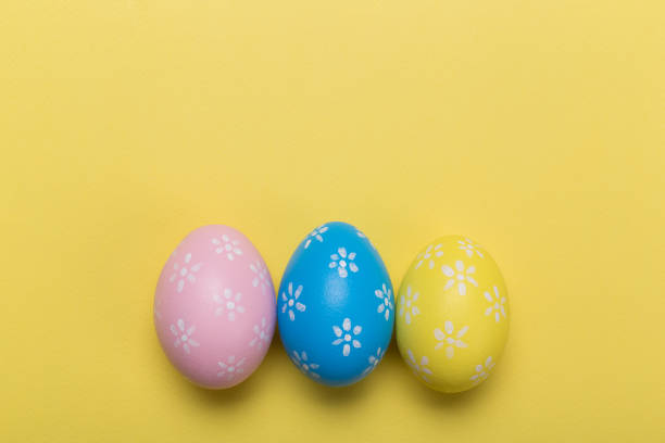 istock easter eggs on yellow pastel color background with space. Concept 1134159229