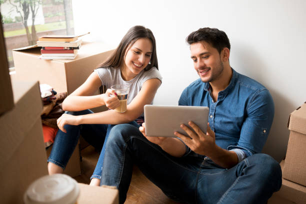 istock Couple looking at how to organize their home 1134163314