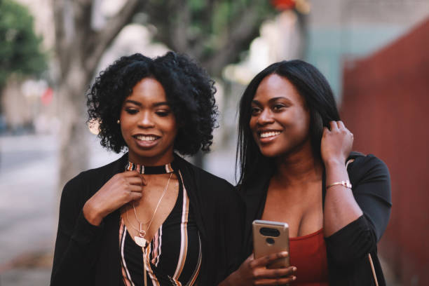 istock Two young female friends talking in downtown LA 1134163951