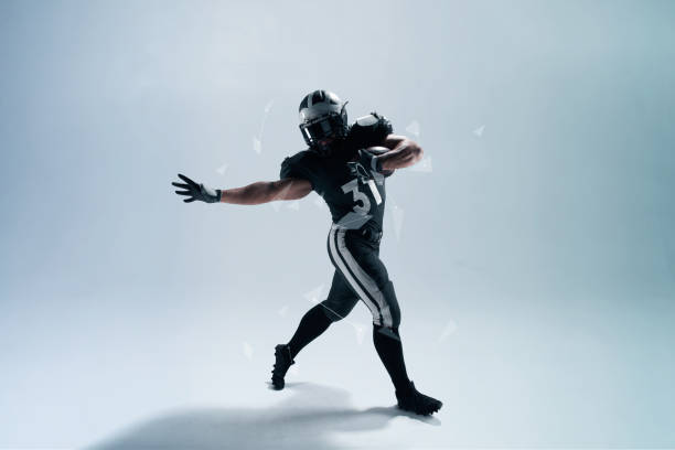 istock American football player on white background with hi tech elements. 1134164104