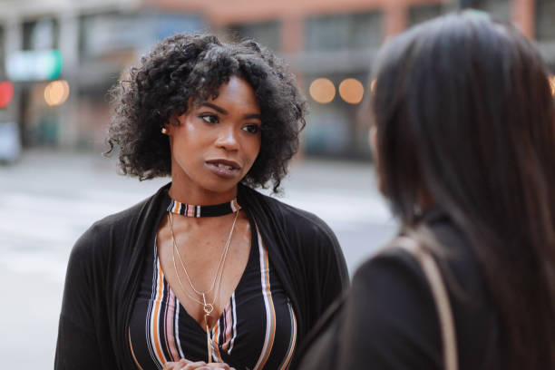 istock Two young female friends talking in downtown LA 1134164114