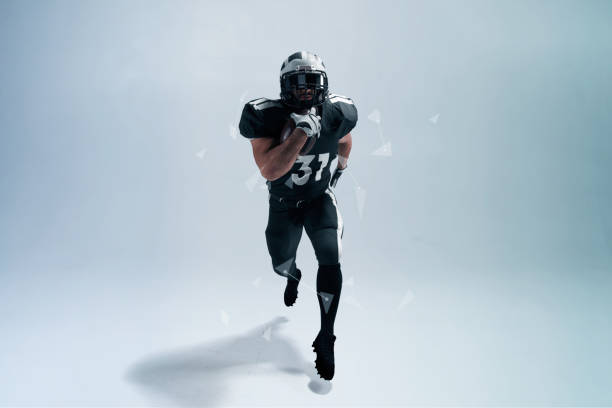 istock American football player on white background with hi tech elements. 1134164122