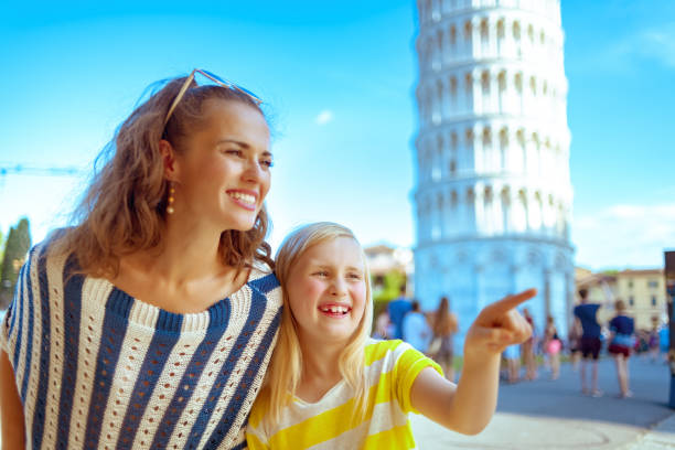 istock mother and child near leaning tower pointing at something 1134165315