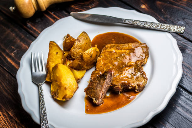 istock Grilled pork steak and fried potatoes 1134165696