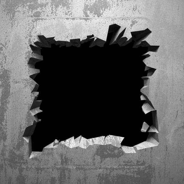 istock Dark cracked broken hole in concrete wall 1134166348