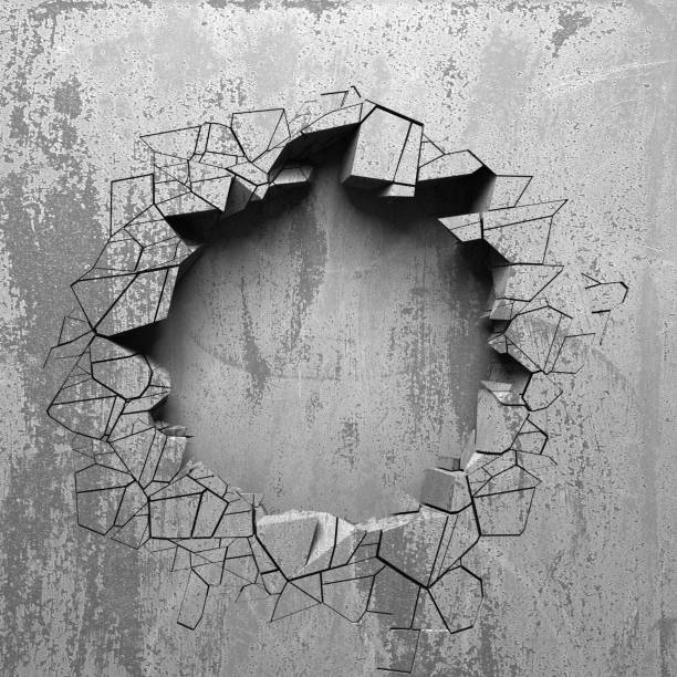 istock Dark cracked broken hole in concrete wall 1134166613