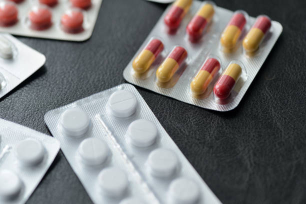 istock Pills and tablets packages  on a dark background close up 1134167978