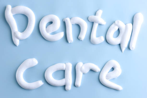 istock Dental care. Text written with white toothpaste on blue. 1134168556