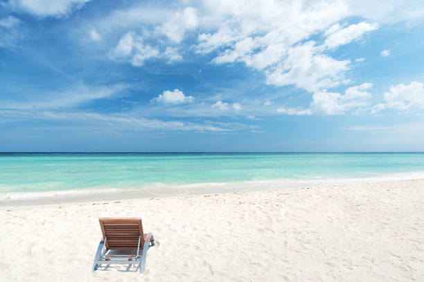 istock Lounge Chair On The Sandy Beach 1134168581