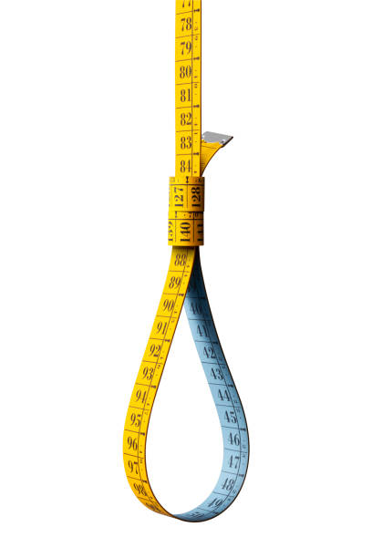 Tape measure noose on white background Tape measure noose on white background. alimentazione non salutare stock pictures, royalty-free photos & images