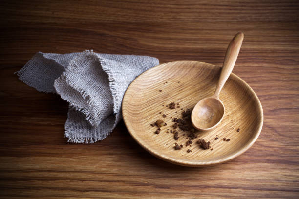 istock Fasting, Lent. Plate with spoon and crumb on wooden background 1134170270