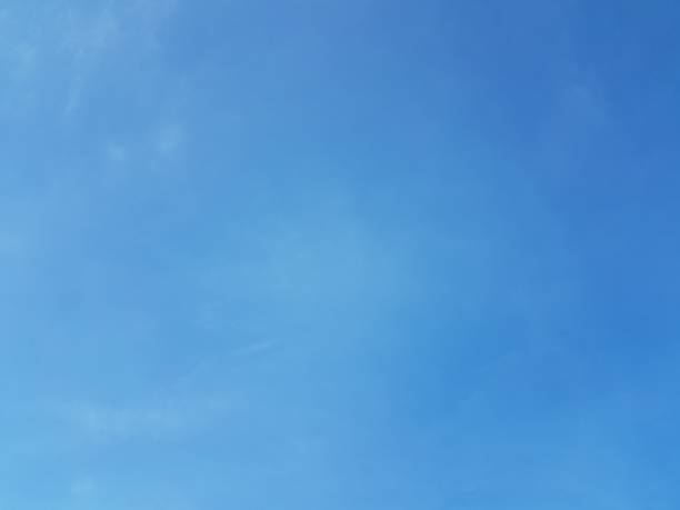 istock Bright blue sky with some white fluffy cloud nature background 1134173665
