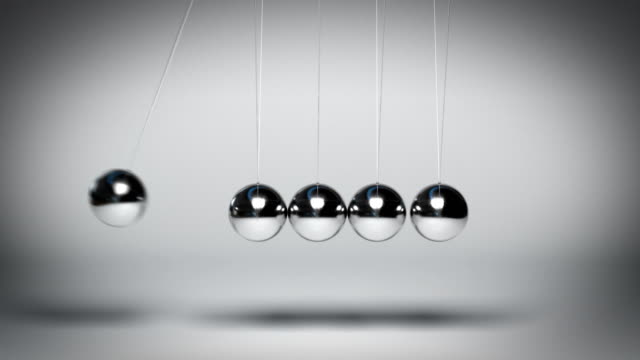 Bouncing Newton's balls against gray background seamless loop