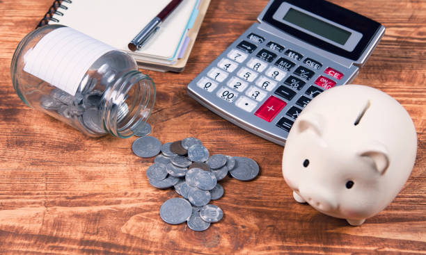 istock calculator, piggy bank and documents 1134181970