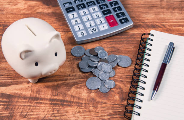 istock calculator, piggy bank and documents 1134181971