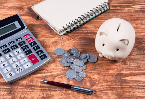 istock calculator, piggy bank and documents 1134181979