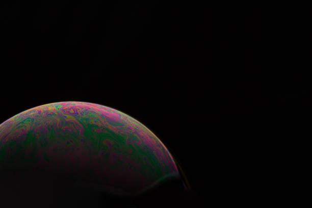 istock A bubble in rainbow colors on a black background. 1134187476
