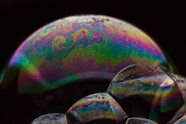 istock A bubble in rainbow colors on a black background. 1134187530