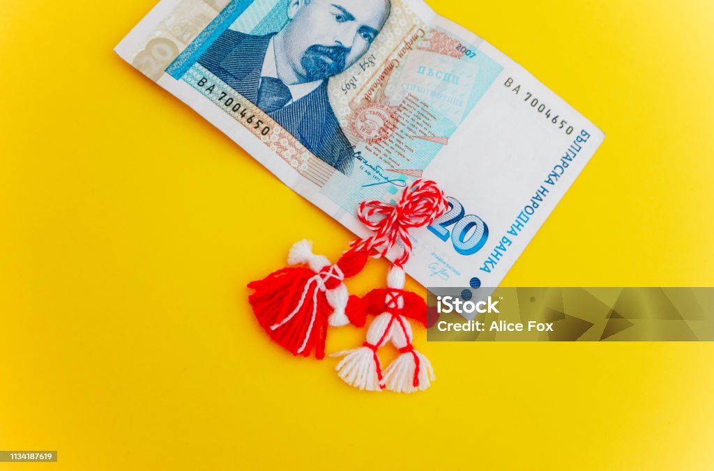 Traditional spring decor martenitsa, Bulgaria. Baba Marta holiday. Bulgarian money leva, shopping concept. Art Stock Photo