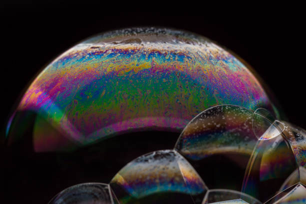 istock A bubble in rainbow colors on a black background. 1134187740