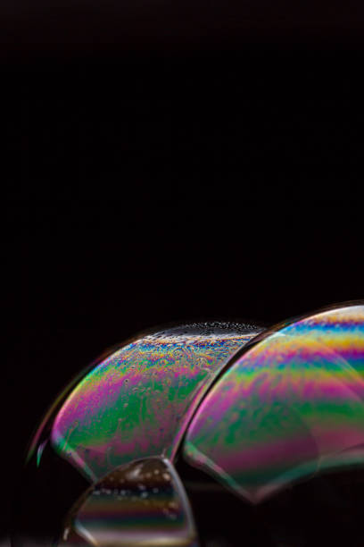 istock A bubble in rainbow colors on a black background. 1134187799
