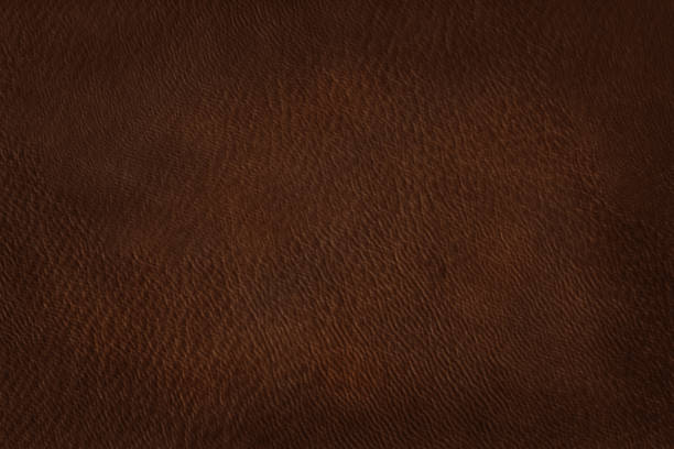 istock Close up of brown leather texture background with seamless pattern. 1134188175