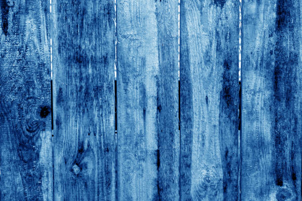 istock Old grunge wooden fence pattern in navy blue tone. 1134189738