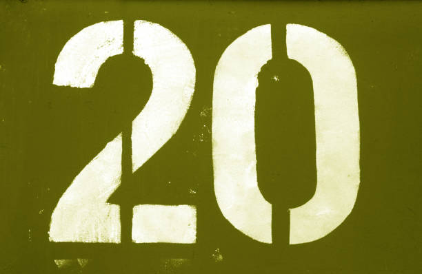 istock Number 20 in stencil on metal wall in yellow tone. 1134189842