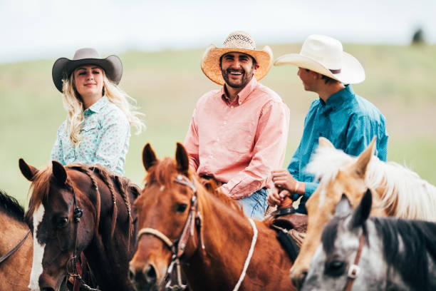 istock Adult cowboys riding galloping horses 1134191086