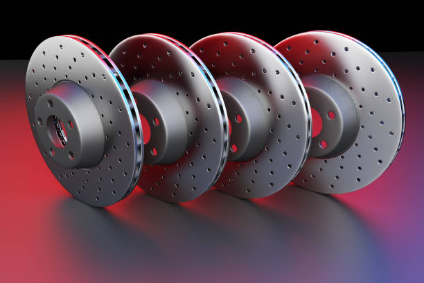 Auto spare parts for passenger car, new brake disk on white background. Multicolored brake disk for brake system