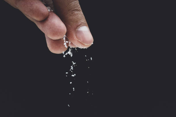 istock seasoning salt cooking on black background 1134192771