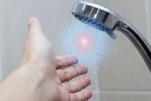 istock hand in the shower test water temperature 1134193694