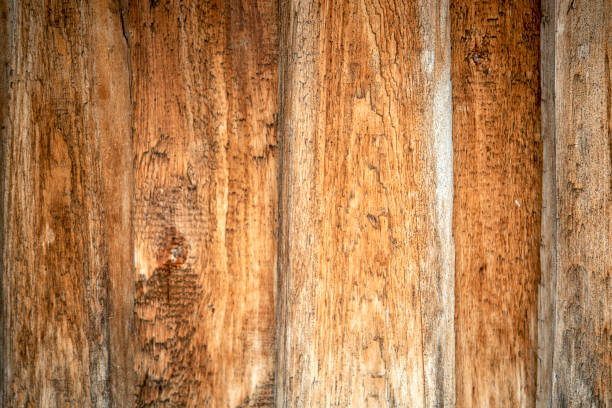 istock Wooden wall of unpainted rough vertical boards 1134193753