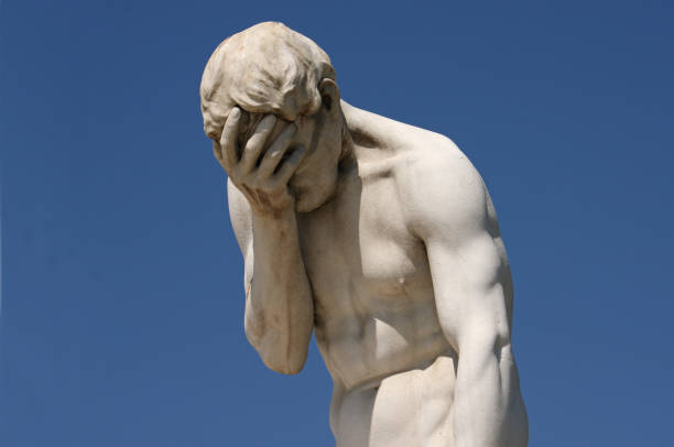 Facepalm: statue with head in hands Marble statue with head in hands in front of blue sky (Statue: "Cain" by Henri Vidal, 1896, in the public Tuileries Garden, Paris, France) facepalm stock pictures, royalty-free photos & images