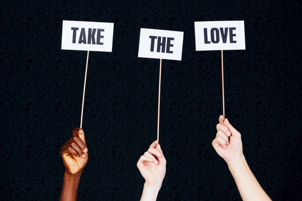 istock Three hands raise sign 