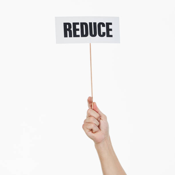 istock Single raised hand holds sign reading 