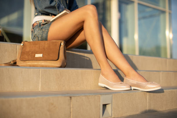 Beautiful green shoes with clutches on white isolated background
