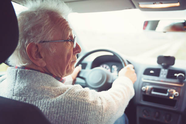 Old gentleman drives car