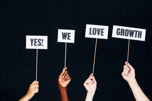 istock Four hands raise sign 